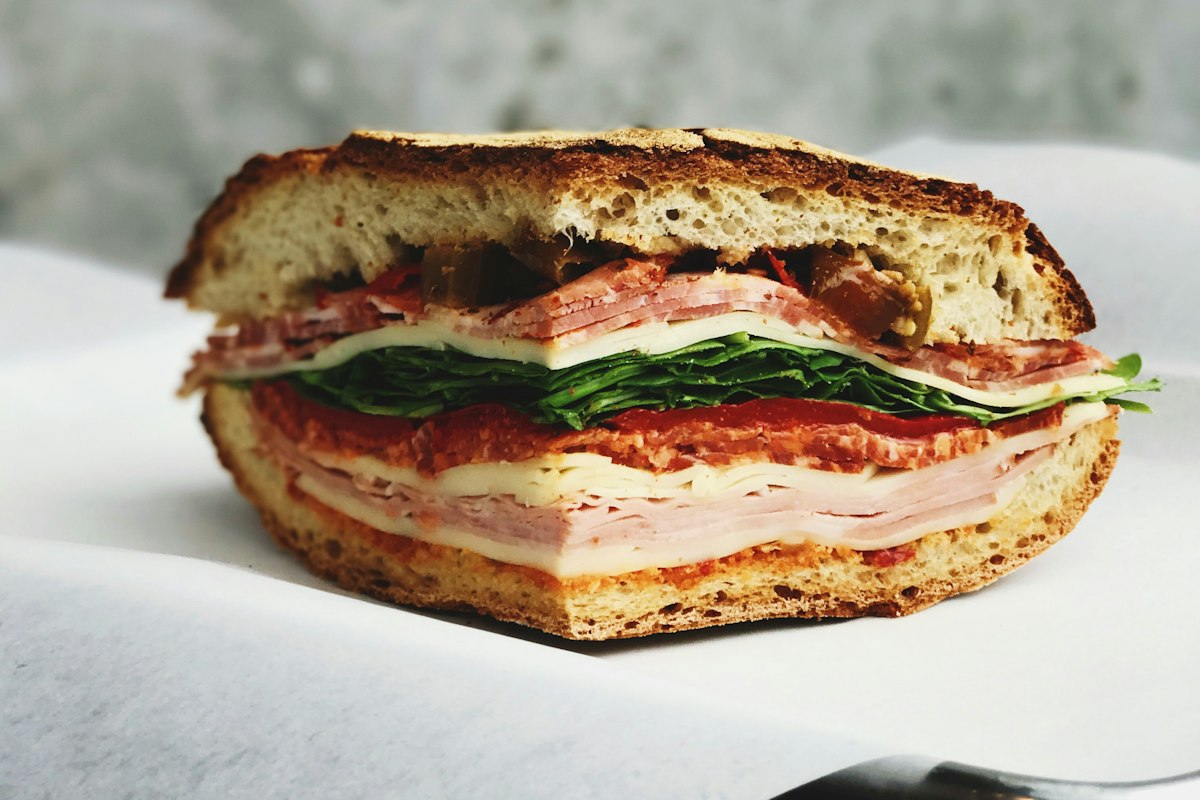 Deli sandwich with sliced meats and cheese